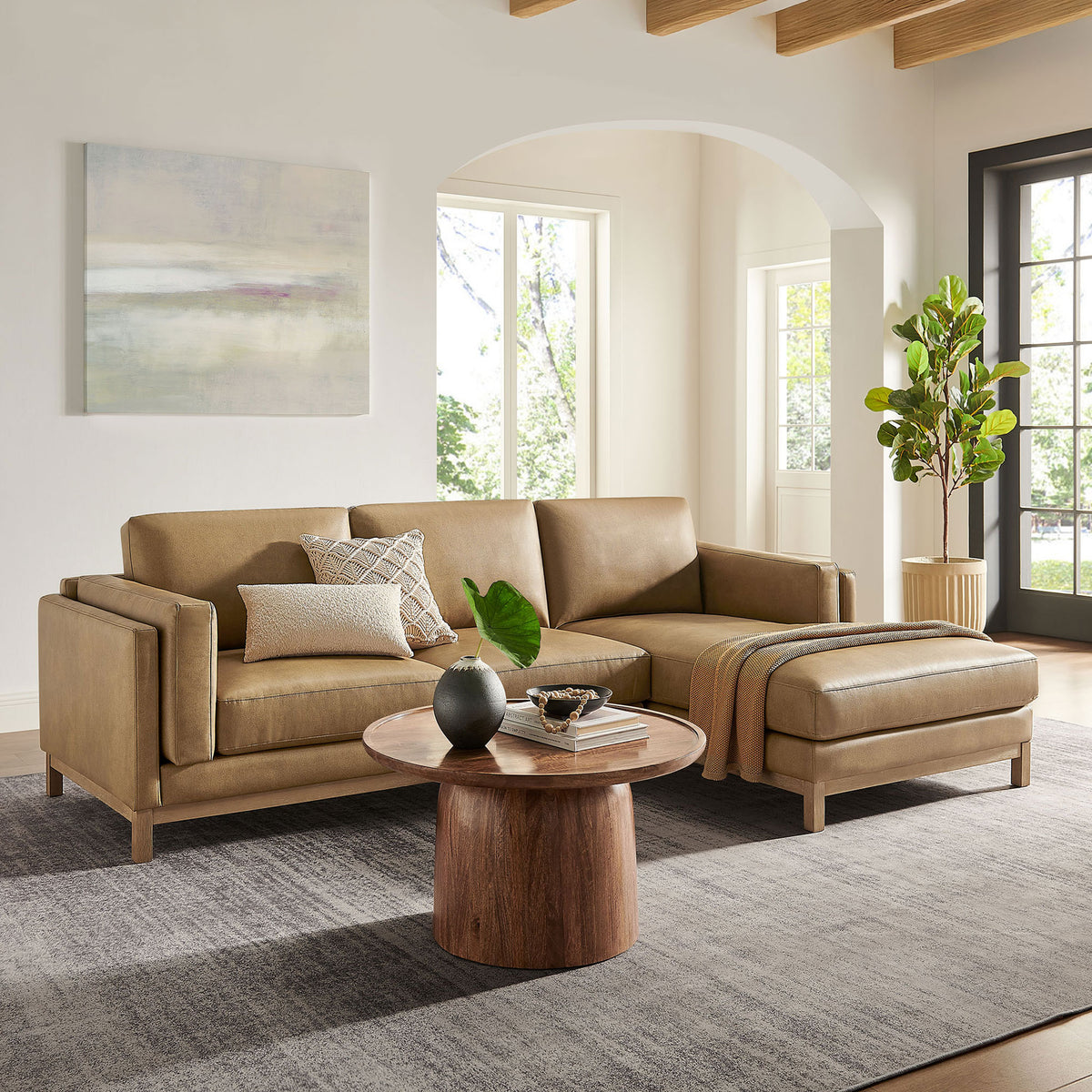 Right-facing Roscoe sectional styled with wood coffee table in bright living space || EEI-7377-TST || front_angle_room