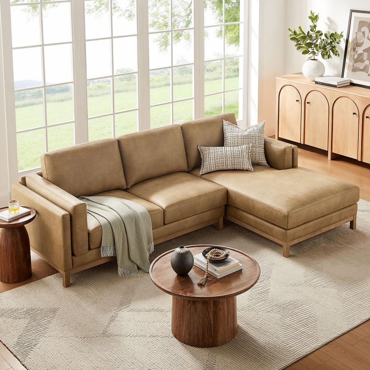 Right-facing Roscoe sectional with chaise layered with pillows and a soft throw || EEI-7377-TST || front_angle_room