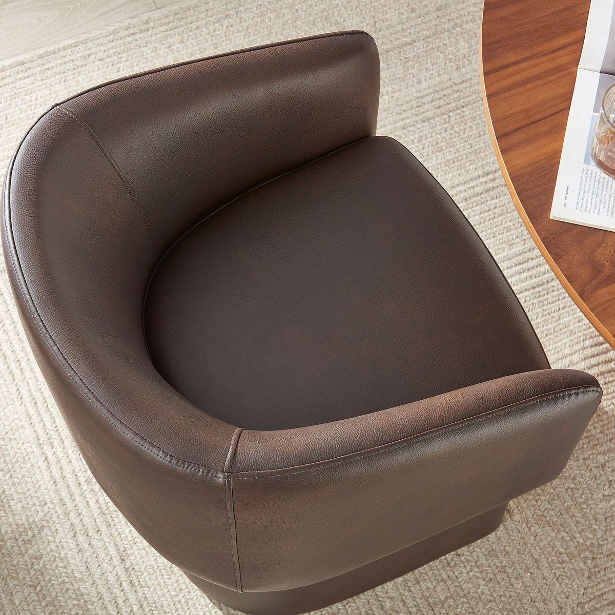 Contoured seat and curved backrest wrapped in rich espresso vegan leather for a cozy embrace || EEI-7383-ESP || detail_room