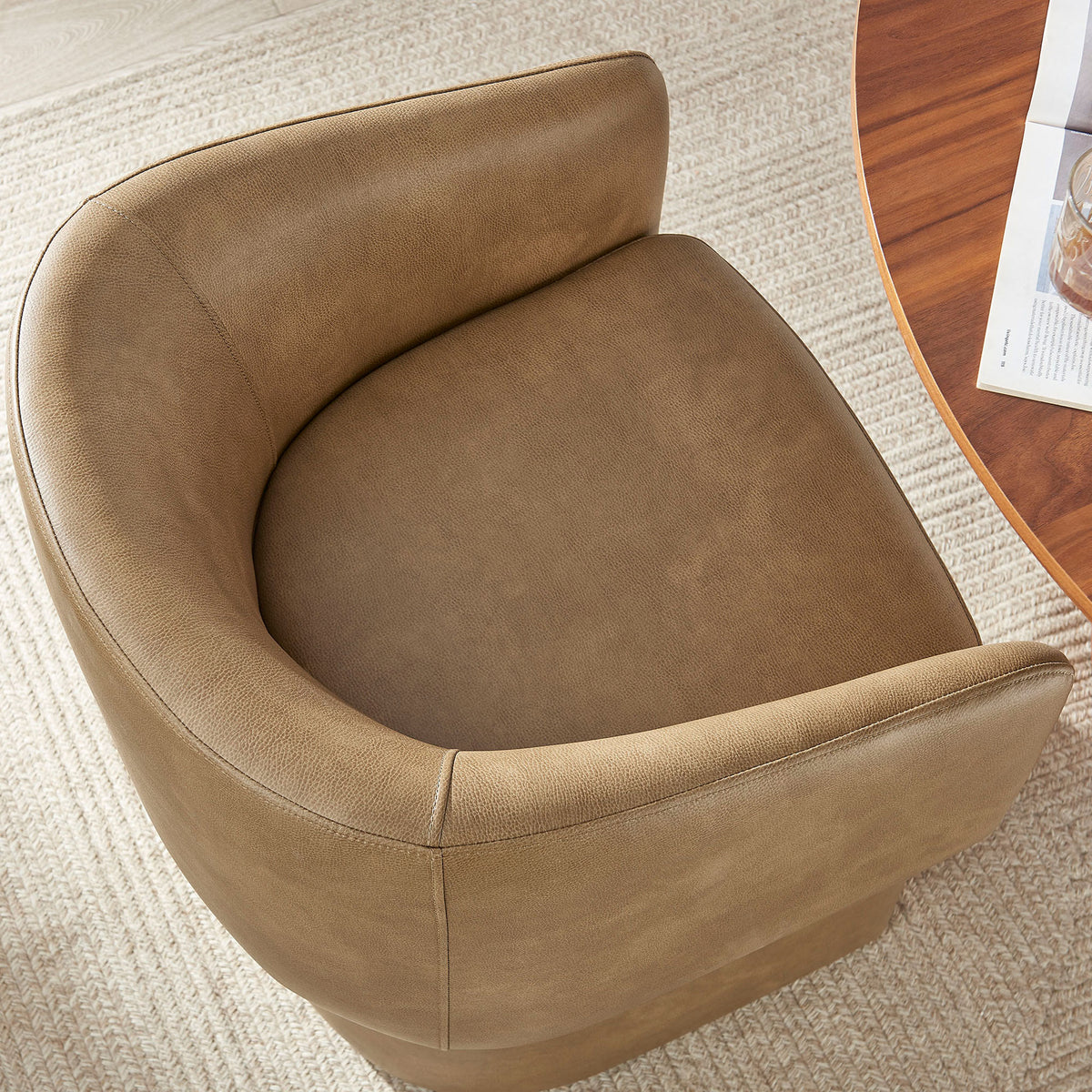Plush seat and hugging barrel back of the toast vegan leather dining chair in a cozy room. || EEI-7383-TST || detail_room