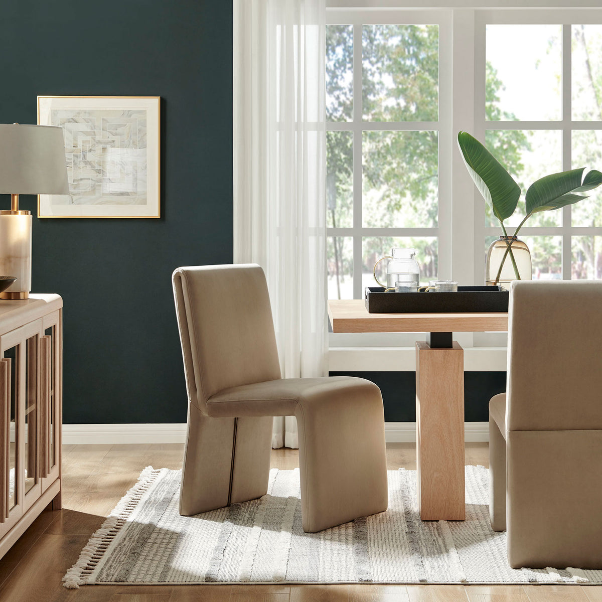 Pair of taupe Emory dining chairs styled around a wooden table to create an inviting contemporary dining room || EEI-7384-TAU || front_angle_room