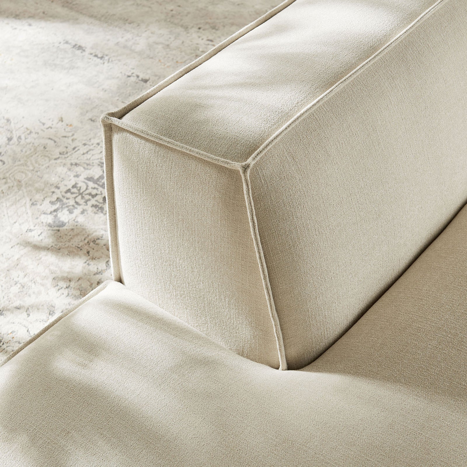 Textured upholstery with refined piping adds a polished, durable finish || EEI-7386-ECR || detail_room