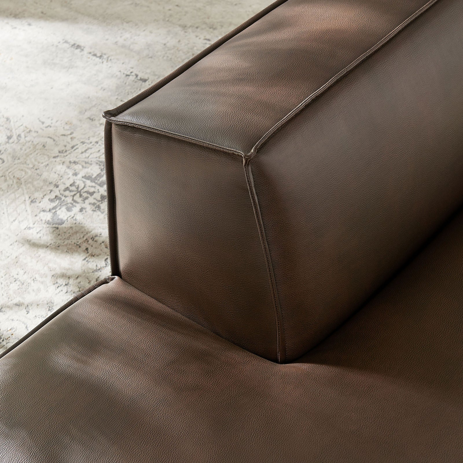 Close-knit piping and supple vegan leather add inviting texture to this left-facing chaise. || EEI-7387-ESP || detail_room