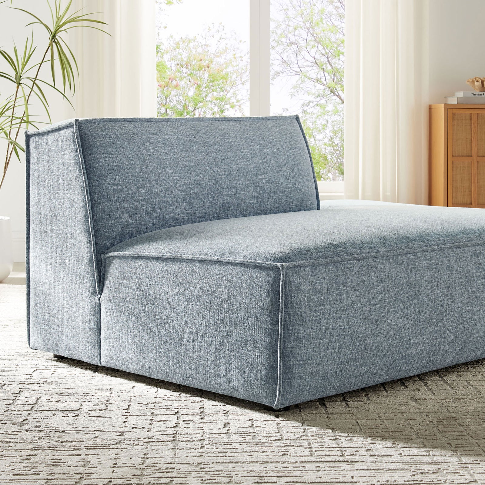 Woven texture and crisp piping bring polished detail to this sky blue modular chaise || EEI-7388-SKY || detail_room
