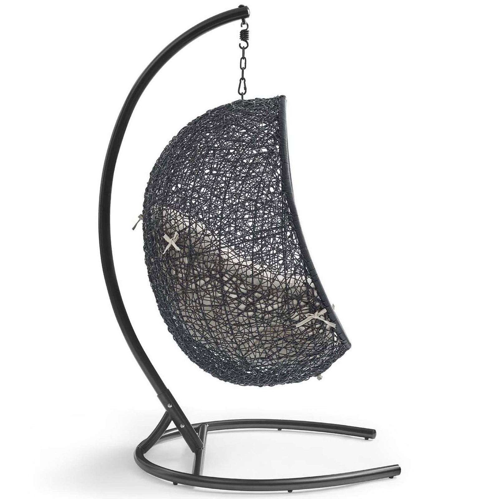 Curved steel base gracefully suspends the woven beige cushion swing chair for outdoor relaxation || EEI-739-BEI-SET || side_studio