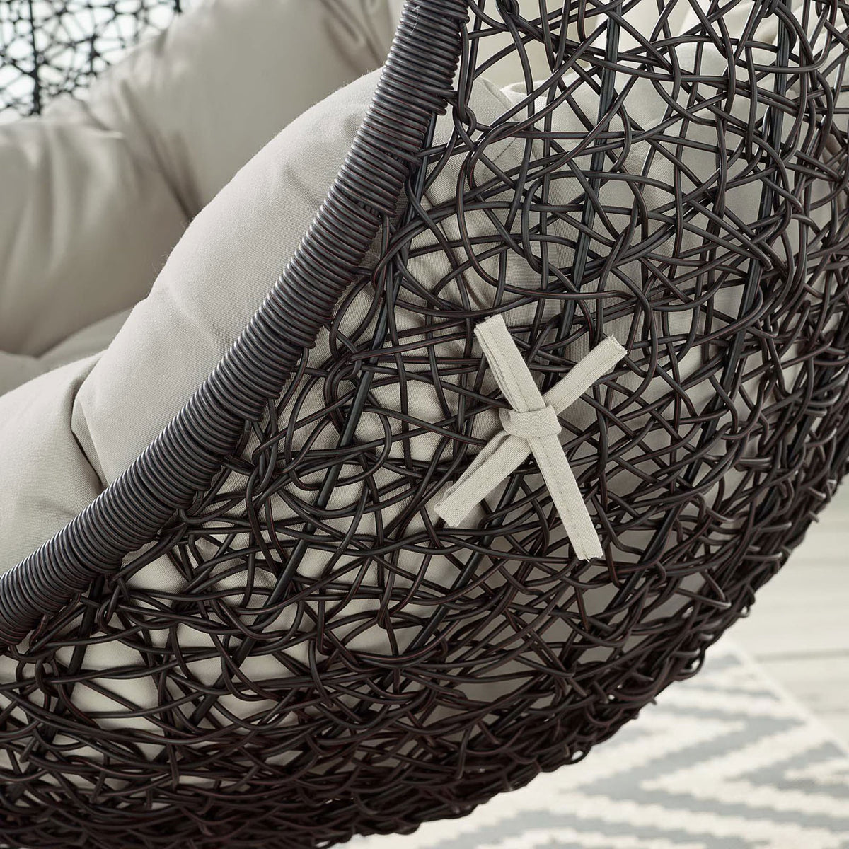 Beige cushion and rattan frame with decorative strap detail add character to the swing chair || EEI-739-BEI-SET || detail_studio