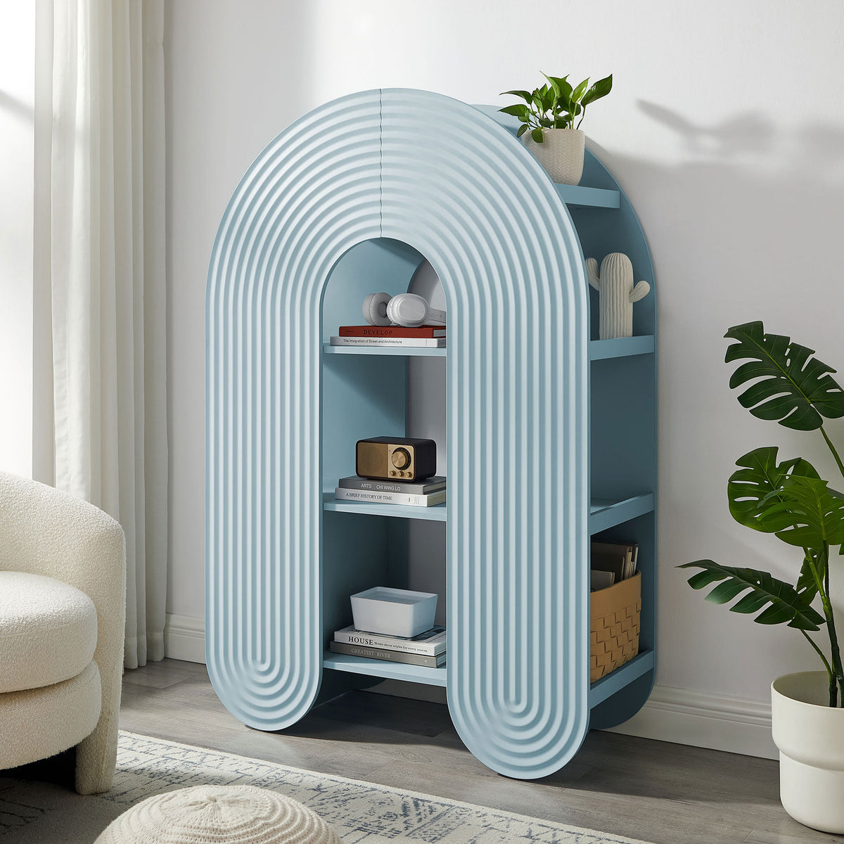 Light blue arched bookshelf brings playful curves and ample storage for books, plants, and decor || EEI-7390-LBL || front_angle_room