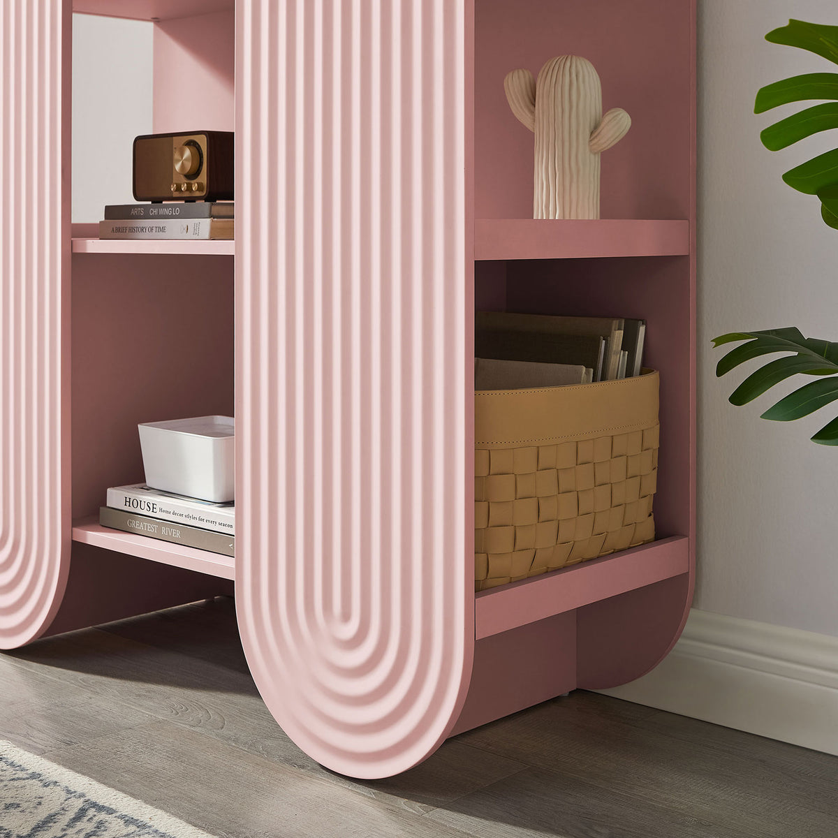 Styled shelving shows everyday items neatly organized within the soft pink arch || EEI-7390-SPN || detail_room