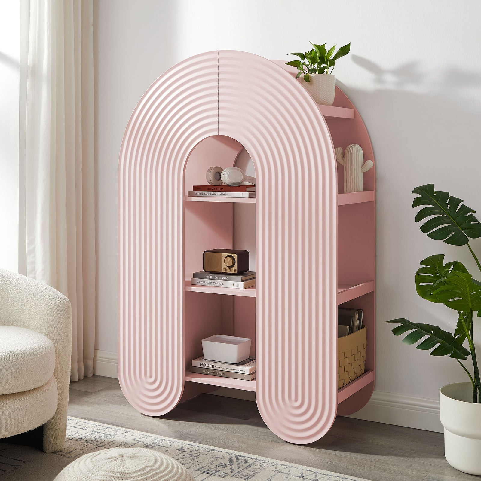 Playful arched bookcase elevates a cozy corner with sculptural lines and versatile open storage || EEI-7390-SPN || front_angle_room