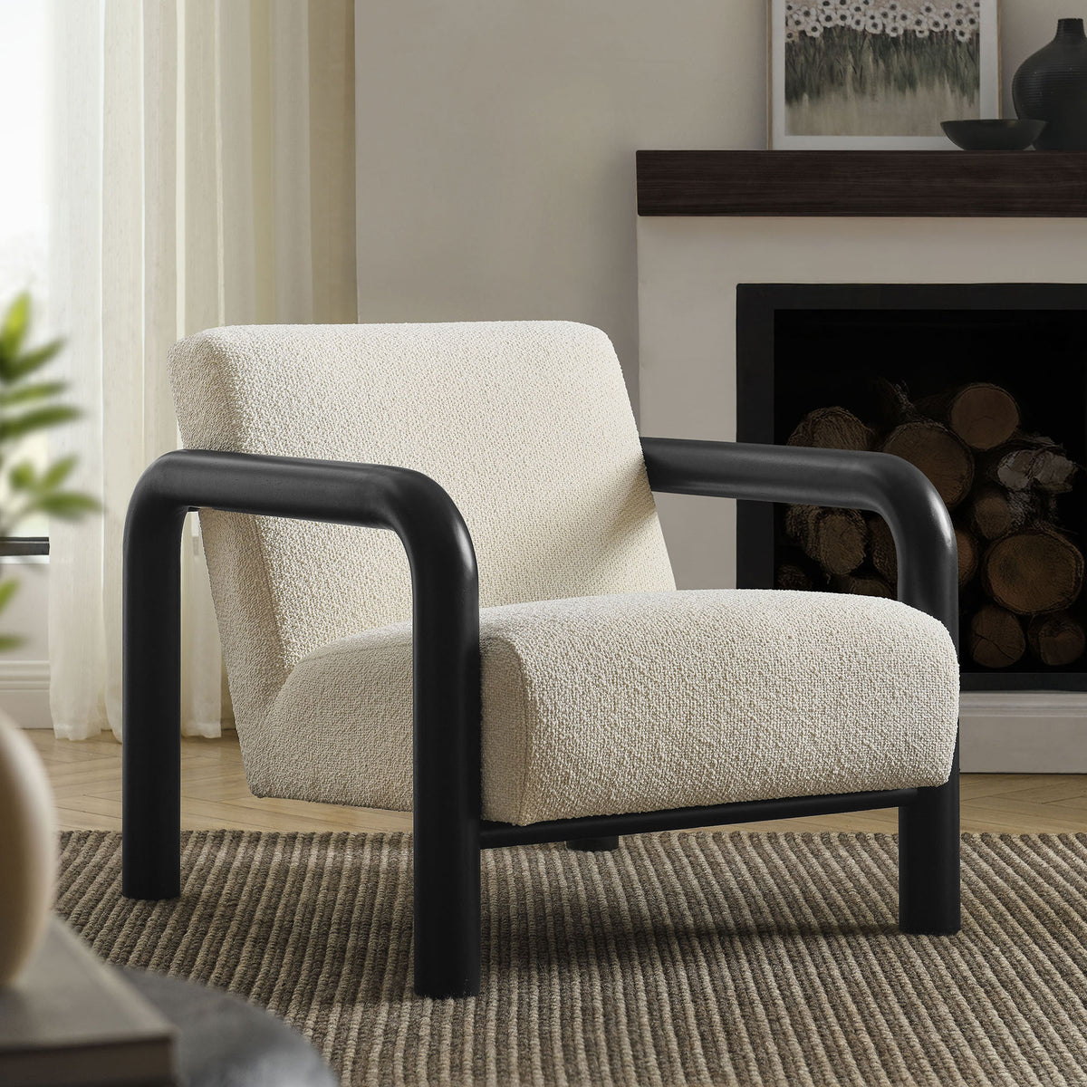 Plush cream boucle pairs with bold black arms to elevate living rooms with sculptural comfort || EEI-7391-CRE-BLK || front_angle_room