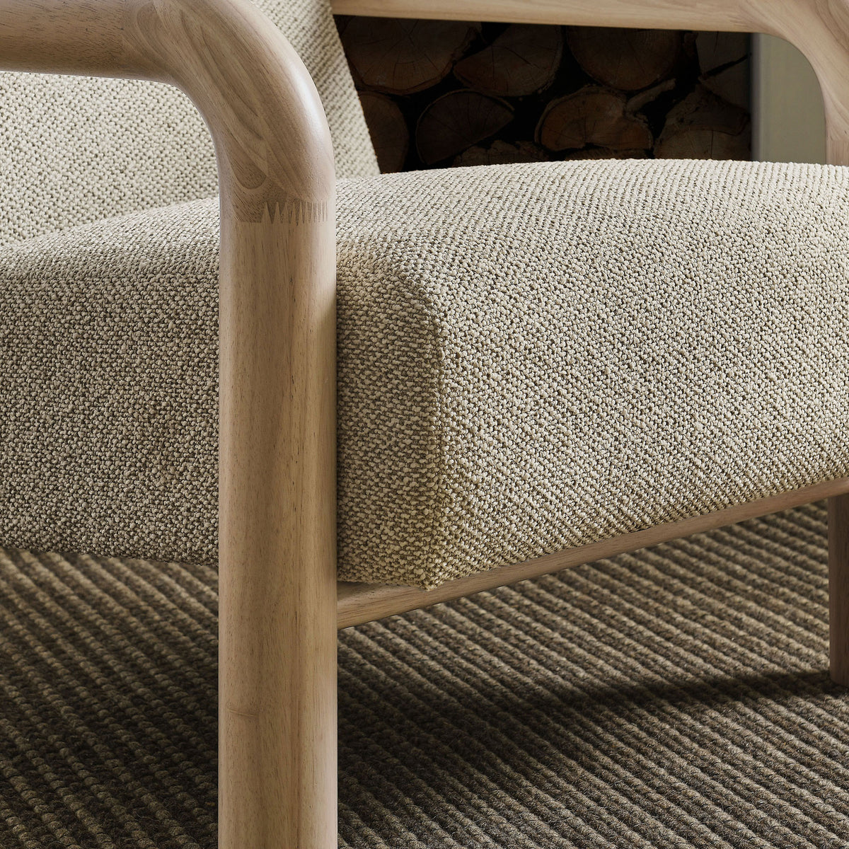 Natural wood arm and nubby boucle seat bring inviting warmth to contemporary interiors || EEI-7391-MRB-OAK || detail_room