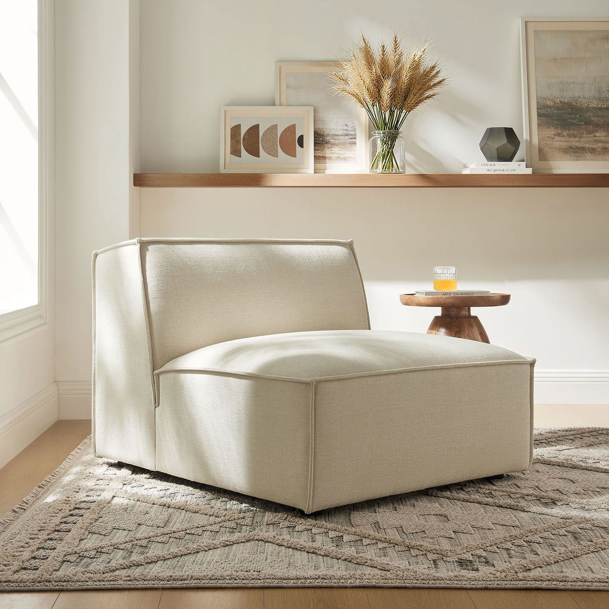Inviting armless lounge chair delivers plush comfort and crisp lines in a cozy living room || EEI-7395-ECR || front_angle_room