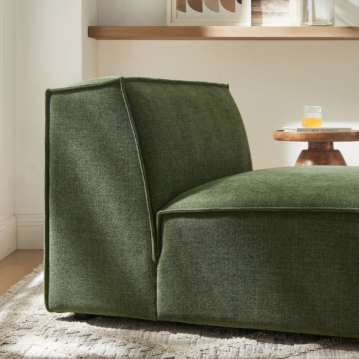 Textured green upholstery and tailored piping bring modern polish to this plush modular chair || EEI-7395-FOL || detail_room