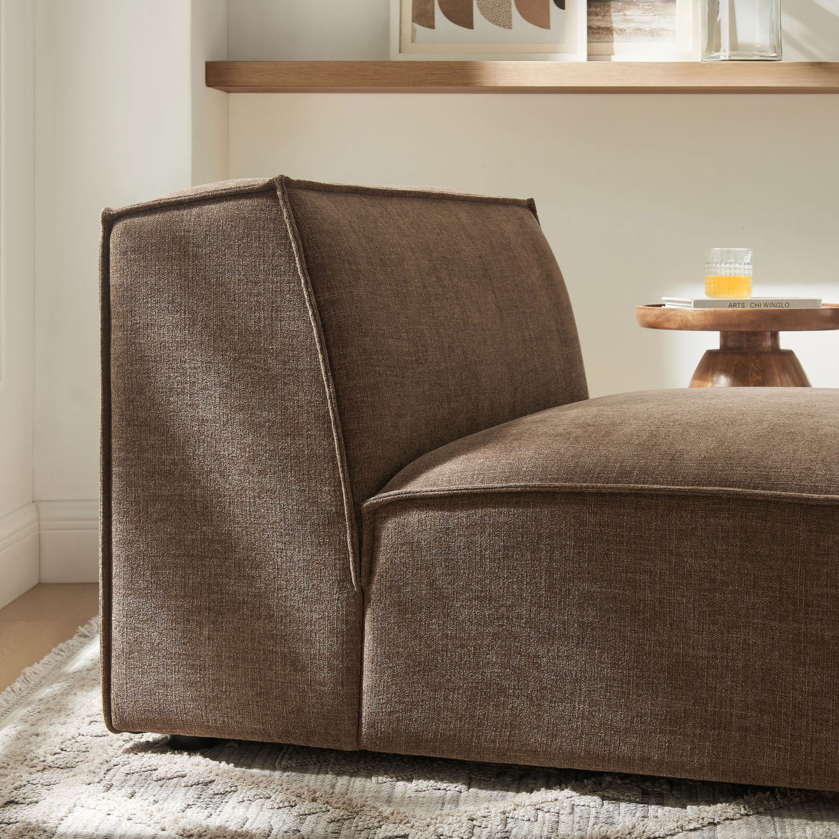 Textured mocha upholstery and tailored piping pair with thick cushioning for relaxed, modern comfort. || EEI-7395-MOC || detail_room