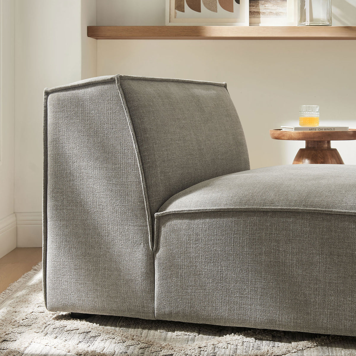 Tonal pewter upholstery pairs with crisp piping for a modern, easy-to-clean finish || EEI-7395-PEW || detail_room