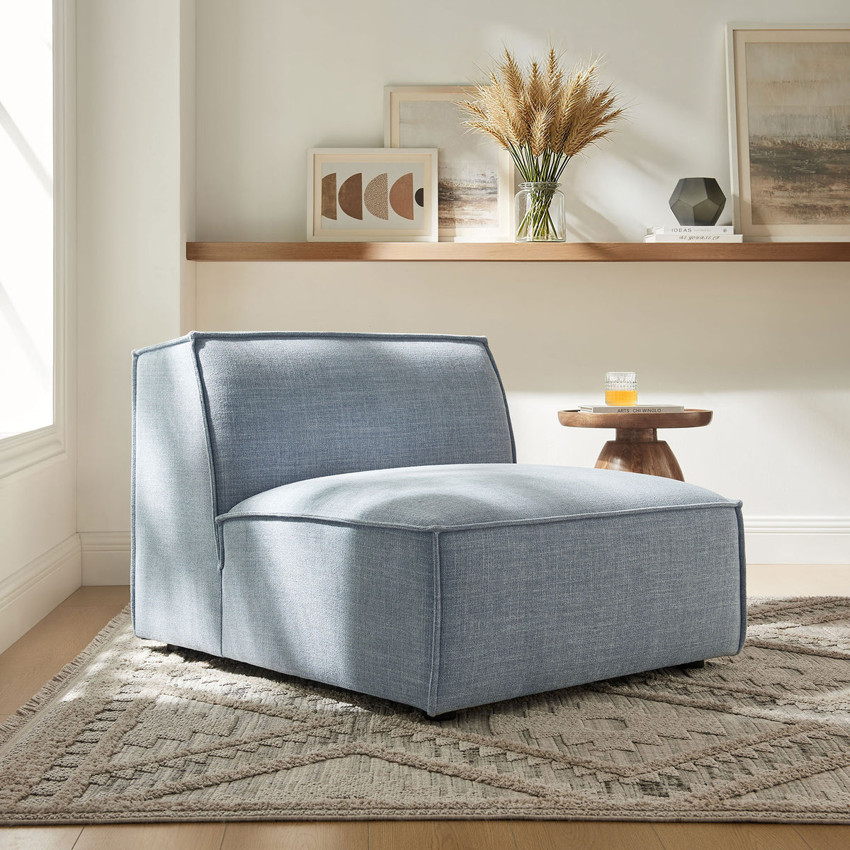 Armless modular chair brings relaxed comfort and modern style to the space in sky blue. || EEI-7395-SKY || front_angle_room