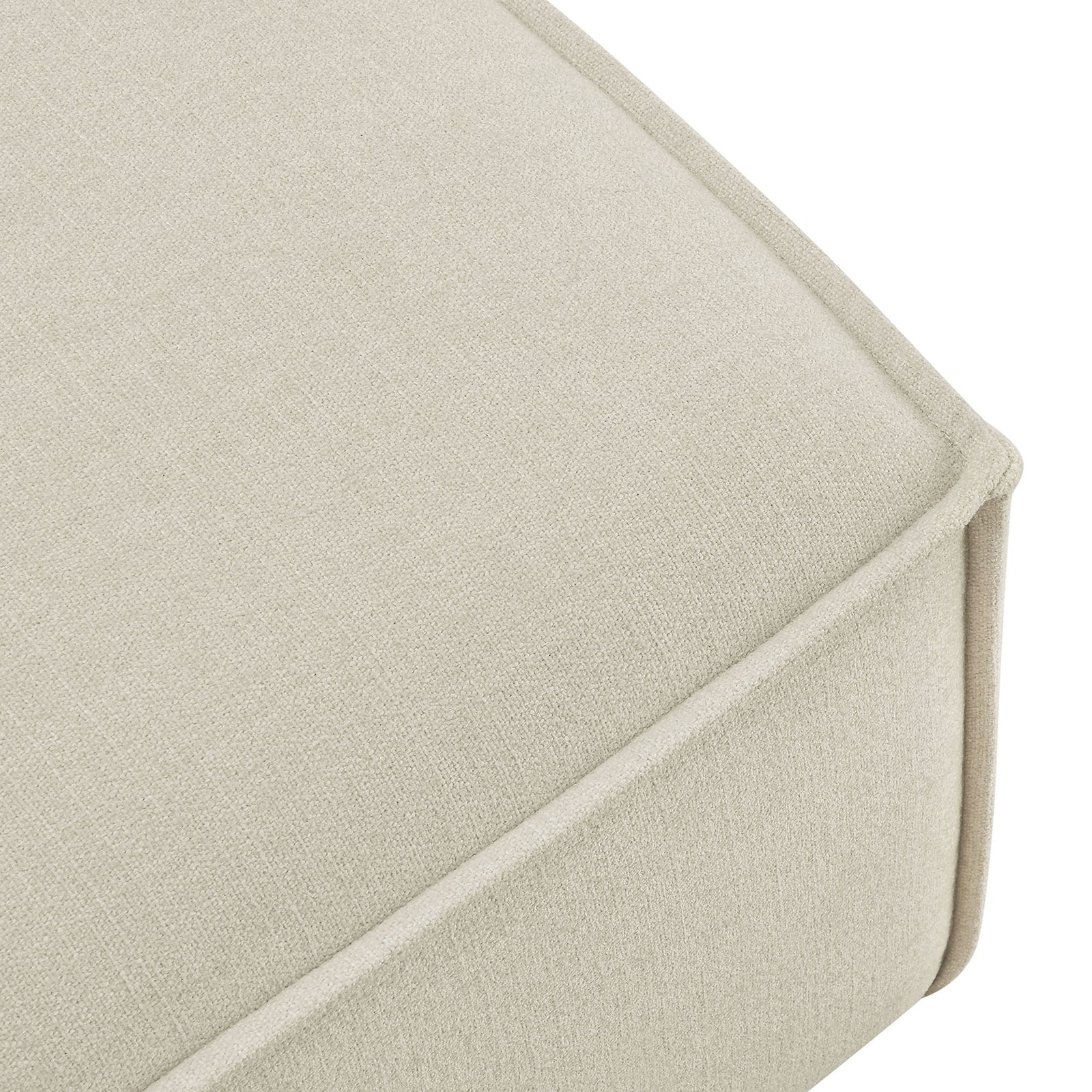 Close view of the ottoman corner shows smooth performance upholstery and crisp French piped seams. || EEI-7401-ECR || detail_studio