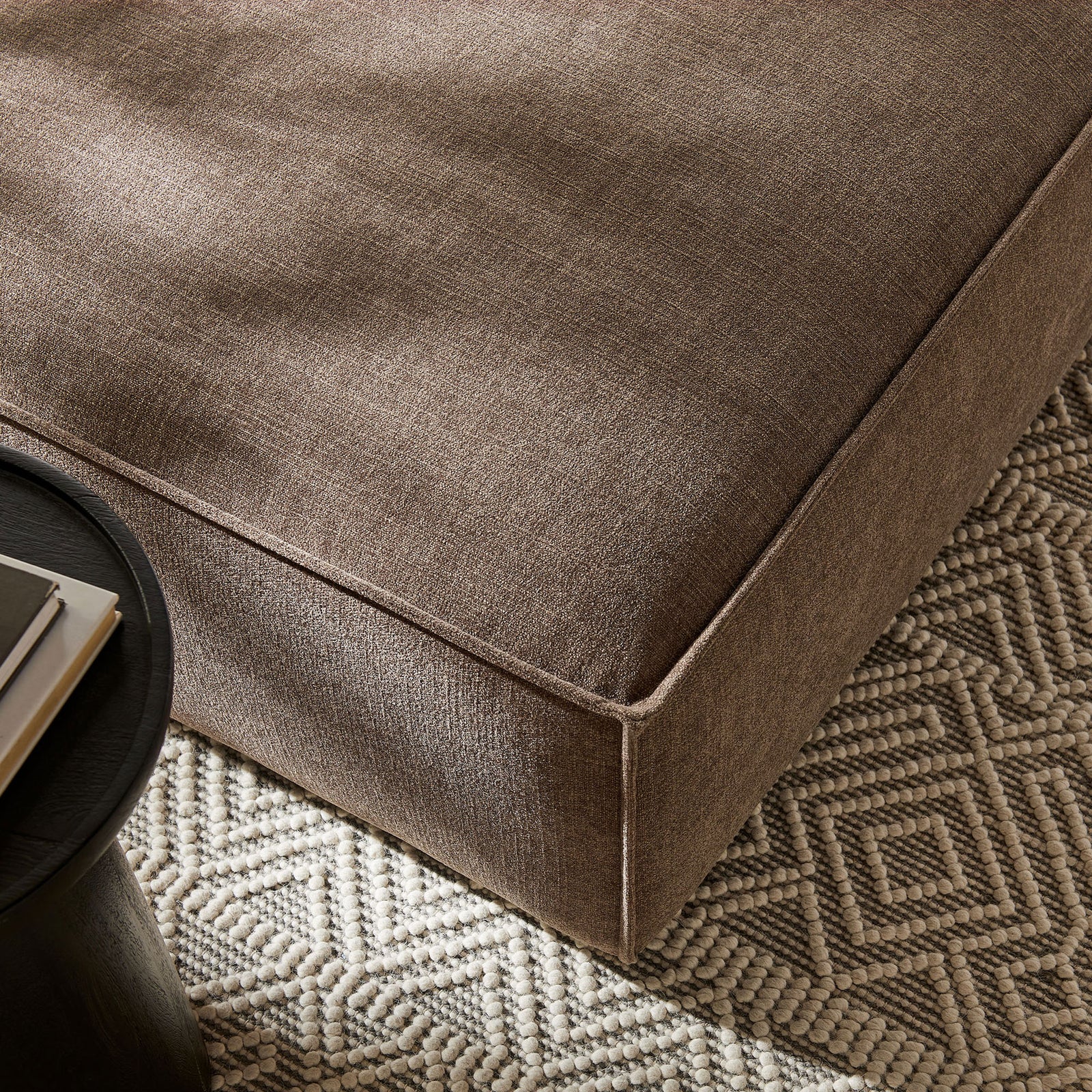Mocha ottoman styled on a patterned rug, pairing soft performance fabric with simple, contemporary lines || EEI-7401-MOC || detail_room