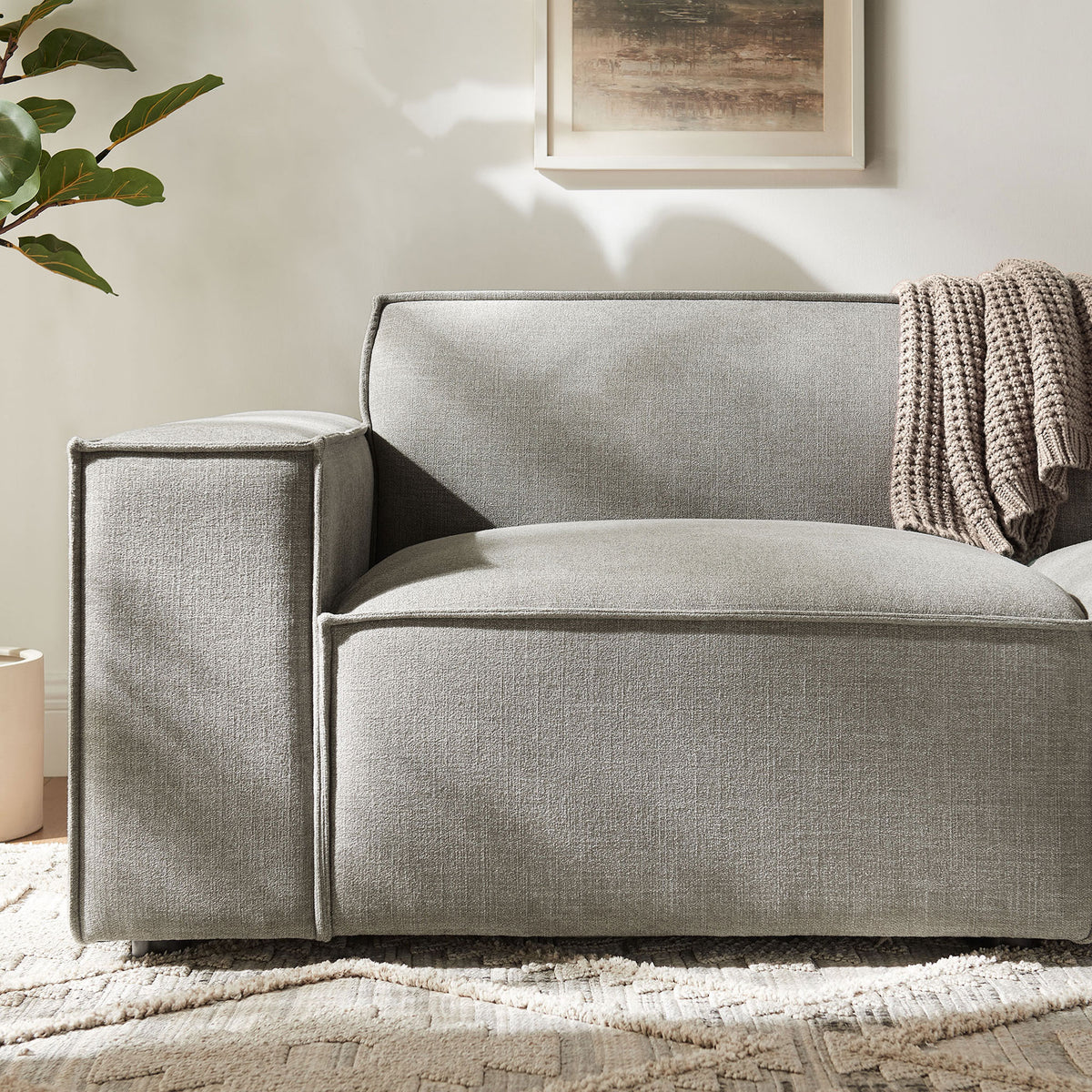 Pewter modular loveseat arm with textured performance fabric and cozy knit throw || EEI-7403-PEW || detail_room