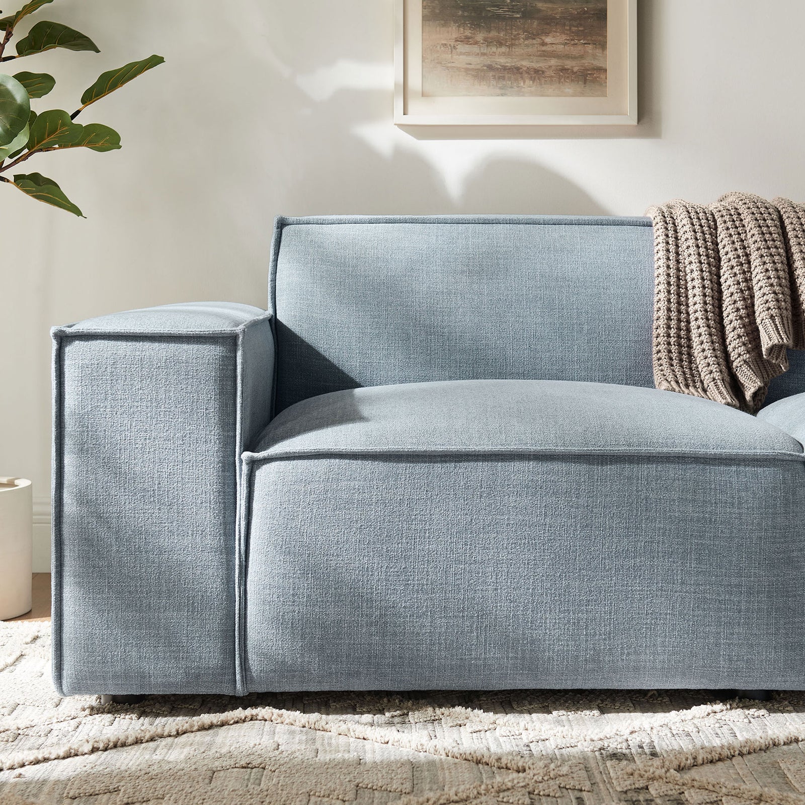 Sky blue loveseat arm and seat highlighting textured performance fabric and French piping detail || EEI-7403-SKY || detail_room