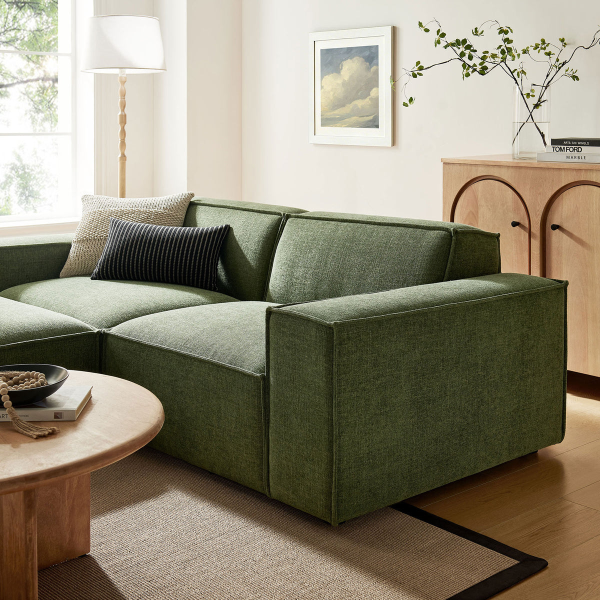 Foliage green modular loveseat styled in a warm modern living room with light wood accents and textured rug || EEI-7405-FOL || detail_room