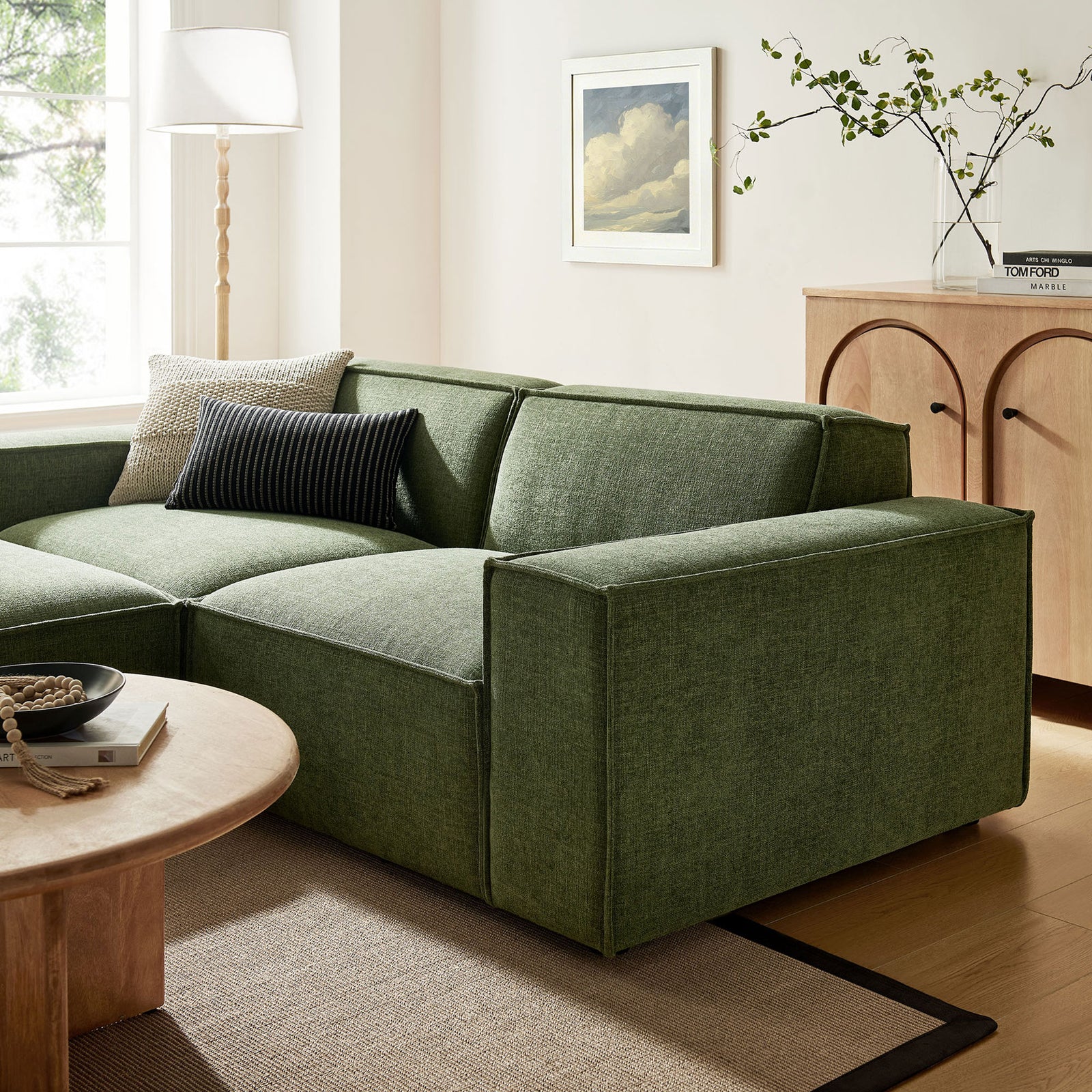 Foliage green modular loveseat styled in a warm modern living room with light wood accents and textured rug || EEI-7405-FOL || detail_room
