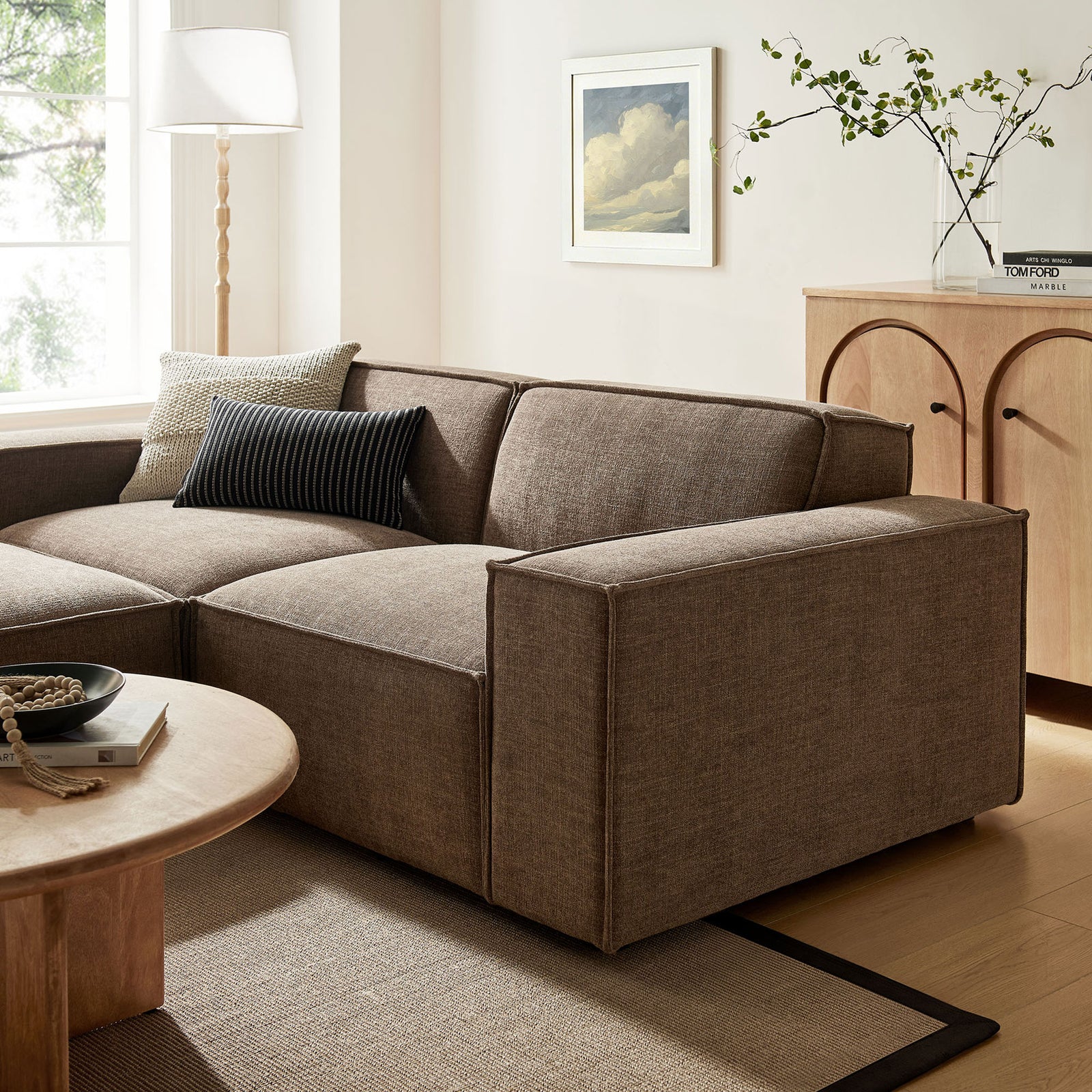 Mocha performance fabric sofa with wide track arms anchors a warm, modern living room with soft, inviting texture. || EEI-7405-MOC || detail_room