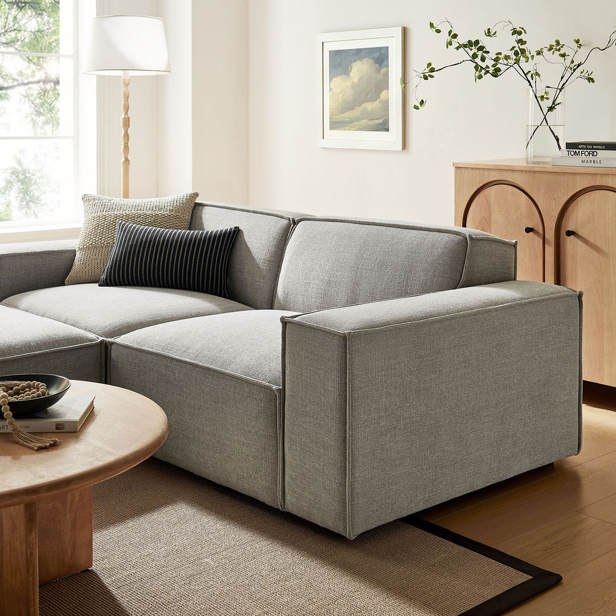 Restore pewter modular loveseat styled in a warm living room with plush cushions and accent pillows || EEI-7405-PEW || detail_room