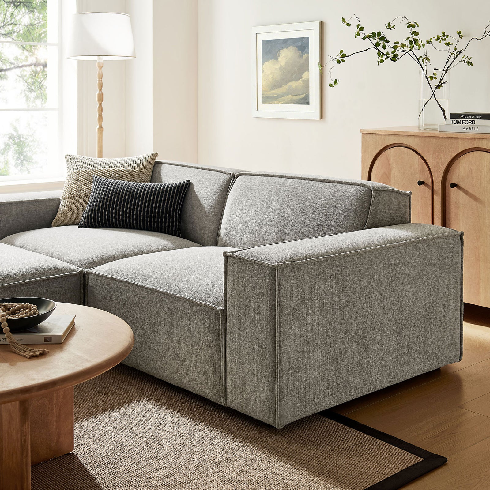Restore pewter modular loveseat styled in a warm living room with plush cushions and accent pillows || EEI-7405-PEW || detail_room