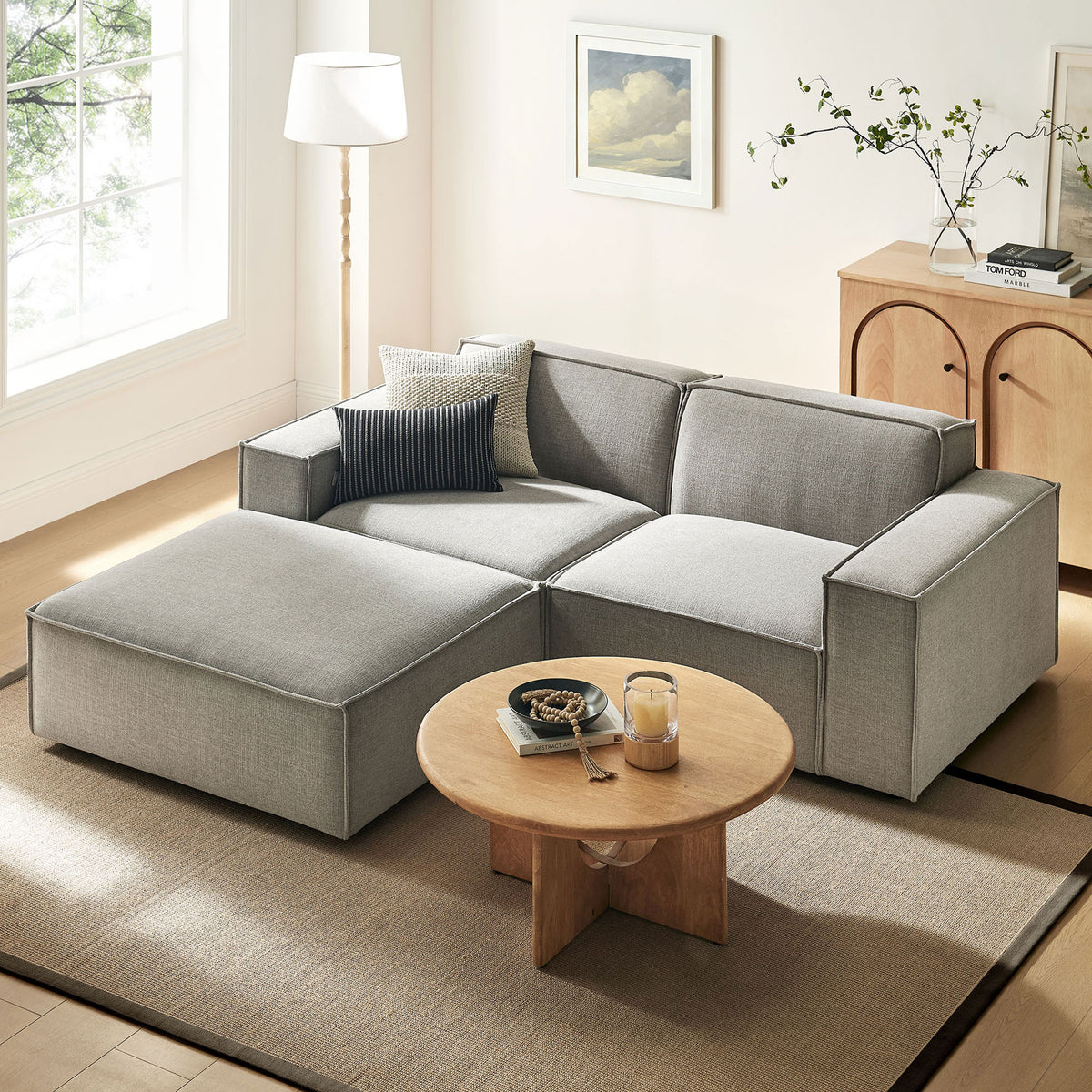 Restore modular loveseat with ottoman in pewter fabric arranged in a bright living room with wood accents || EEI-7405-PEW || front_angle_room