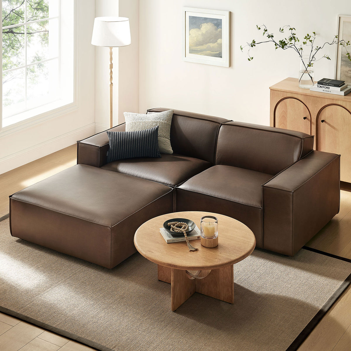 Espresso vegan leather modular loveseat with ottoman anchors a warm, modern living room with inviting lounge comfort. || EEI-7406-ESP || front_angle_room