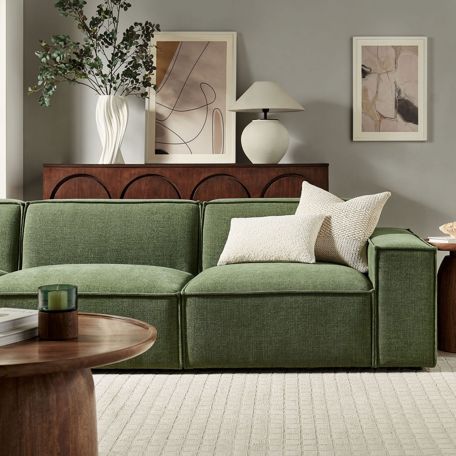 Foliage green modular sofa styled in a warm living room with textured pillows and wood accents || EEI-7407-FOL || detail_room