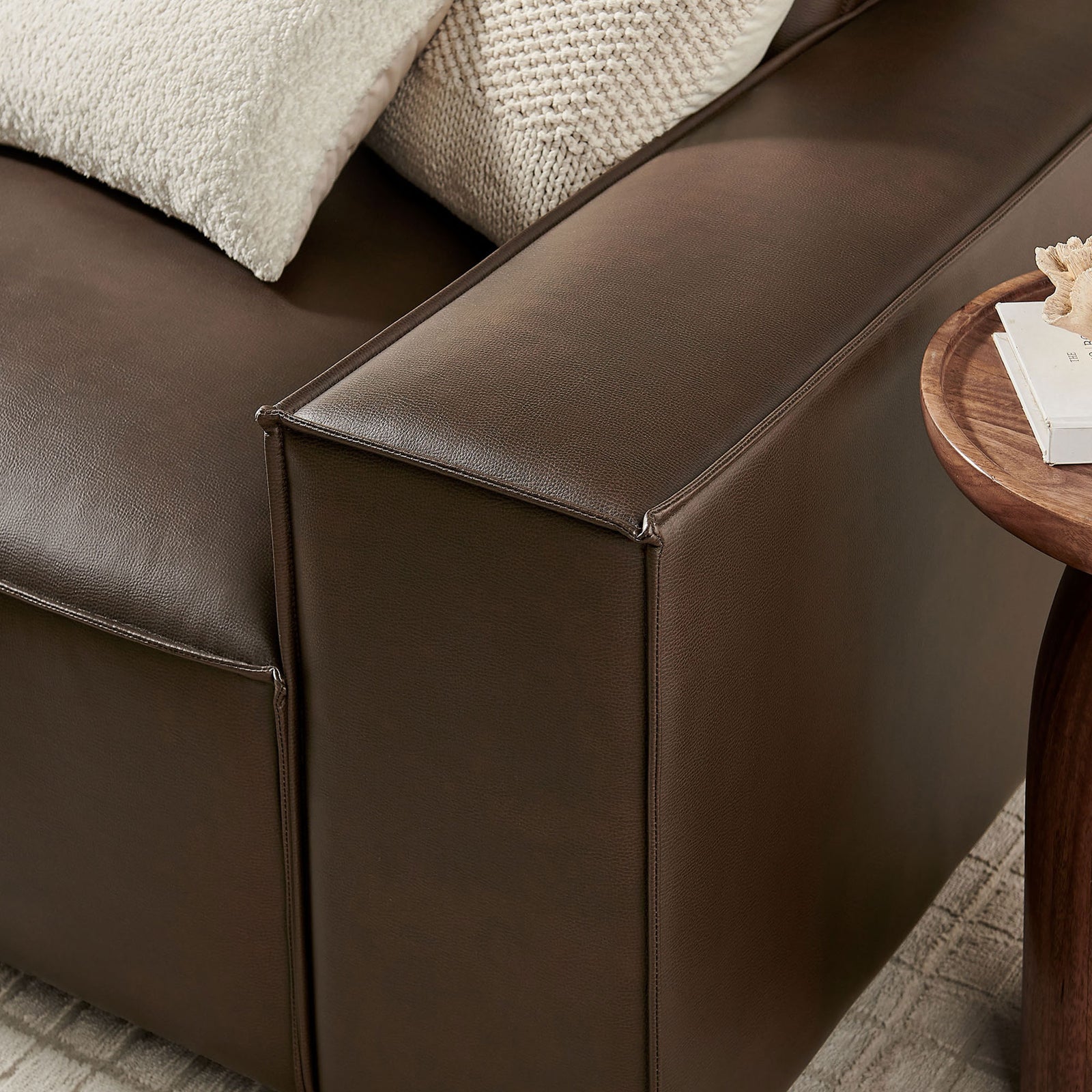 Wide track arm in smooth espresso vegan leather upholstery with tailored stitching and crisp piping || EEI-7408-ESP || detail_room