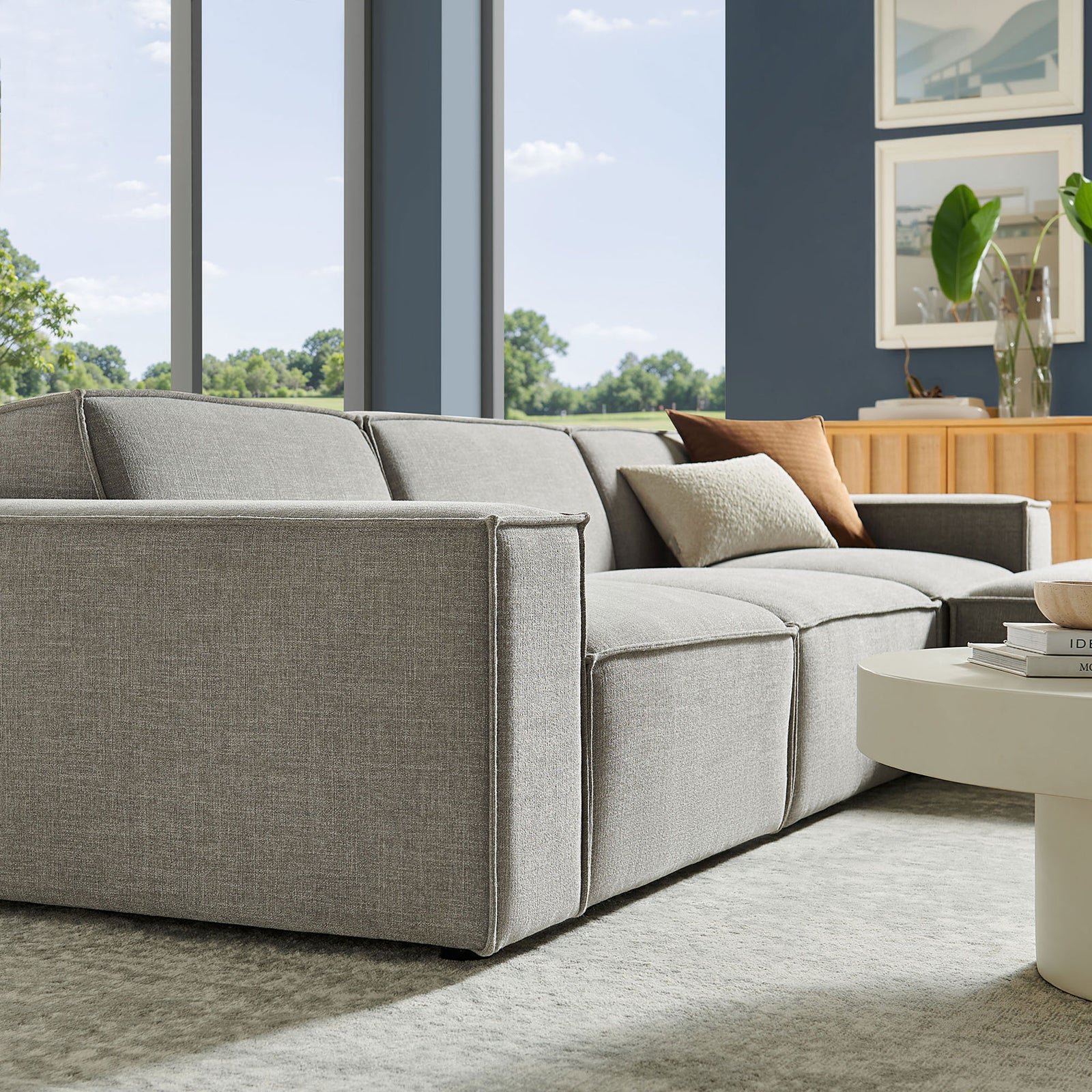 Pewter Restore sectional sofa styled in a bright living room with modern decor accents || EEI-7409-PEW || detail_room