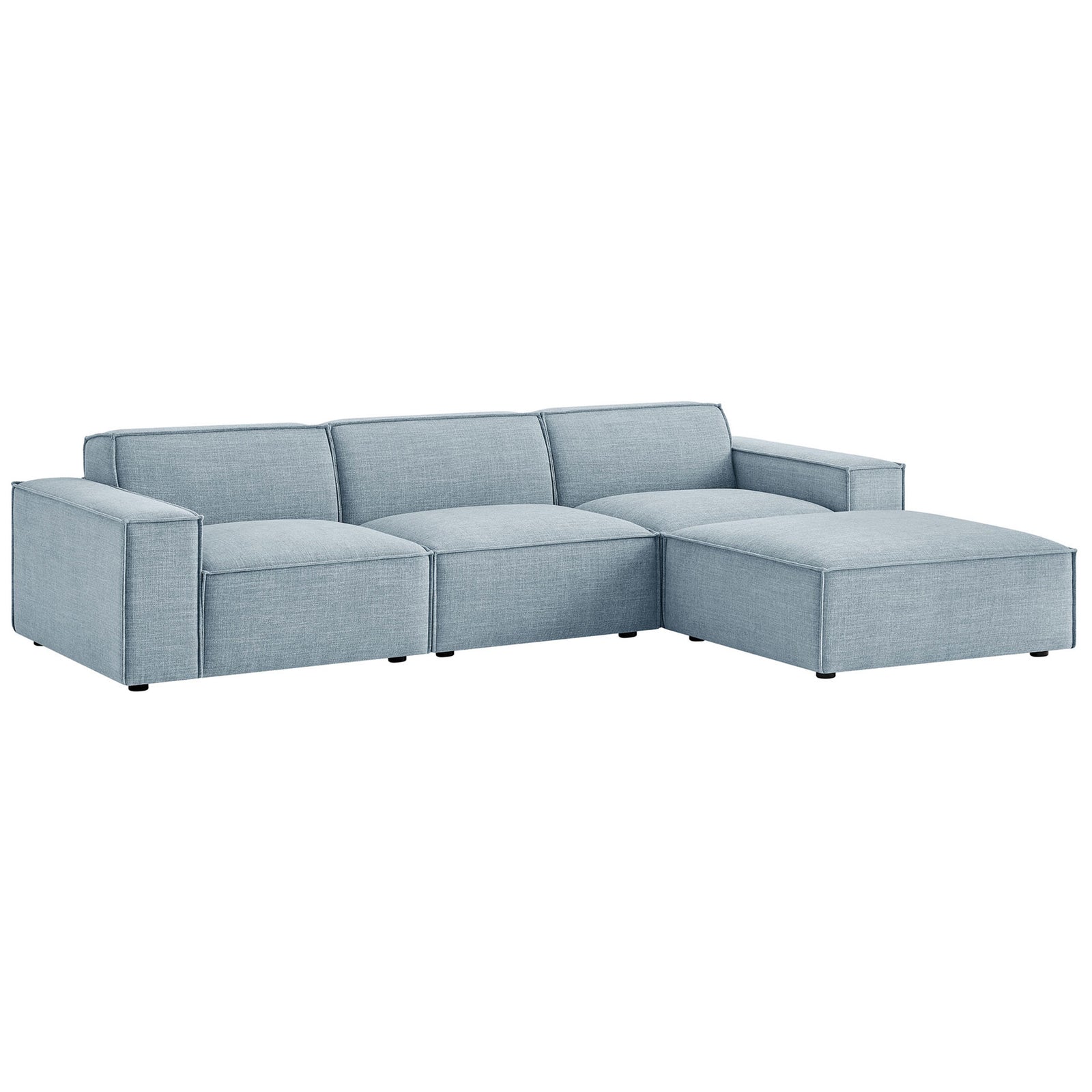 Low-profile sky blue modular sofa set with chaise-style ottoman and clean track arms || EEI-7409-SKY || front_angle_studio