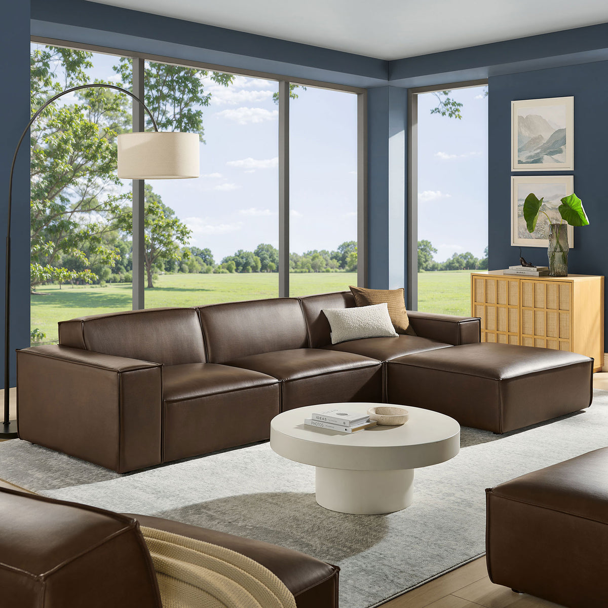 Restore espresso modular sectional with ottoman styled in a bright modern living room with soft accents || EEI-7410-ESP || front_angle_room