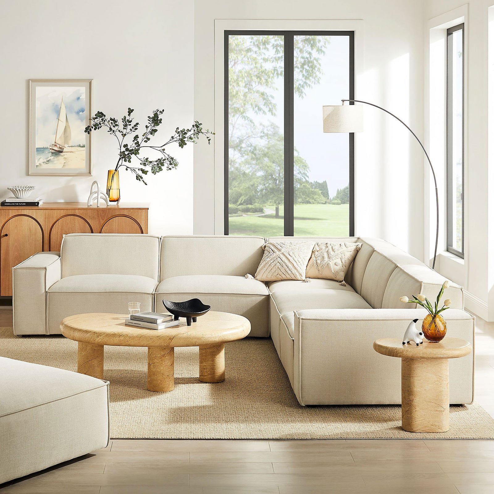 Ecru modular sectional styled in a bright living room with natural wood and neutral decor || EEI-7411-ECR || front_angle_room