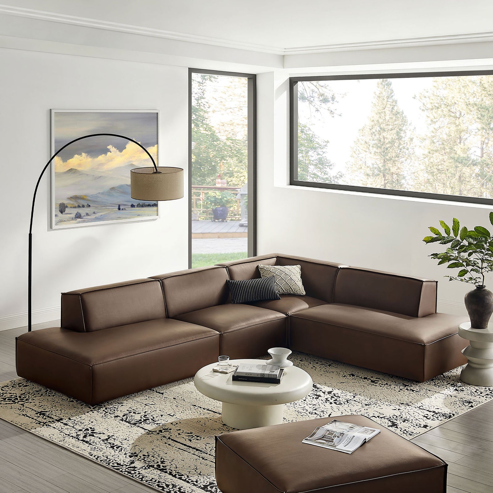 L-shaped Restore sectional anchored on a patterned rug, creating a modern lounge-ready living room centerpiece || EEI-7414-ESP || front_angle_room