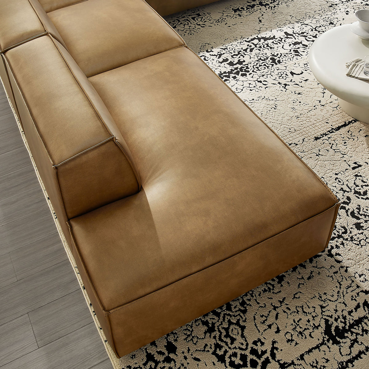 Smooth vegan leather seat and back with tailored French piping detail for a refined look. || EEI-7414-TST || detail_room