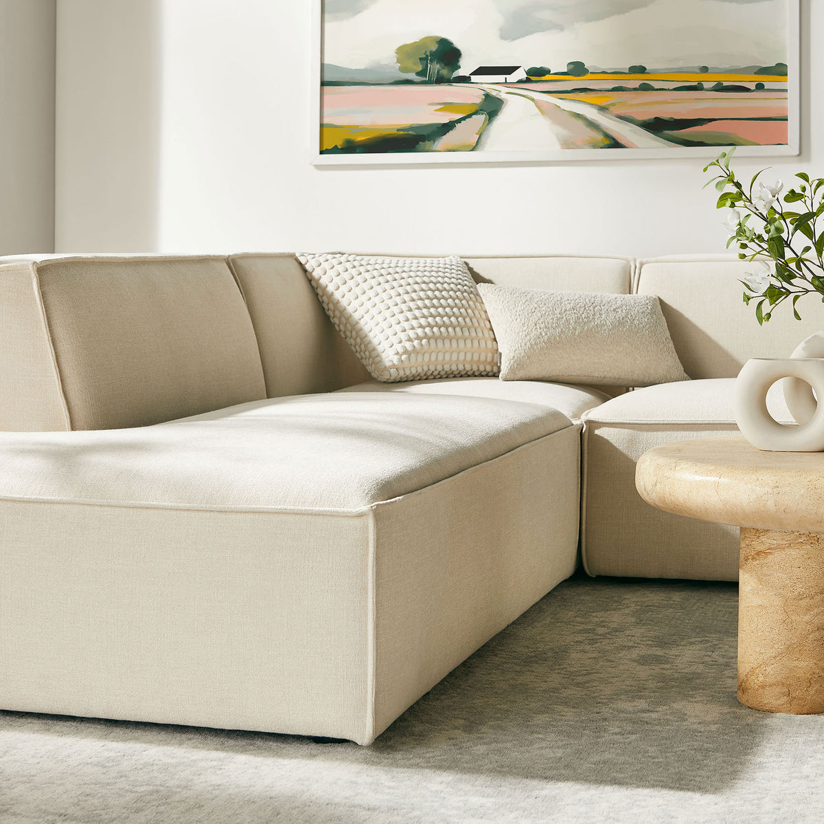 Extended chaise seat in ecru upholstery offers ample room to stretch out with layered, tactile accent pillows. || EEI-7415-ECR || detail_room