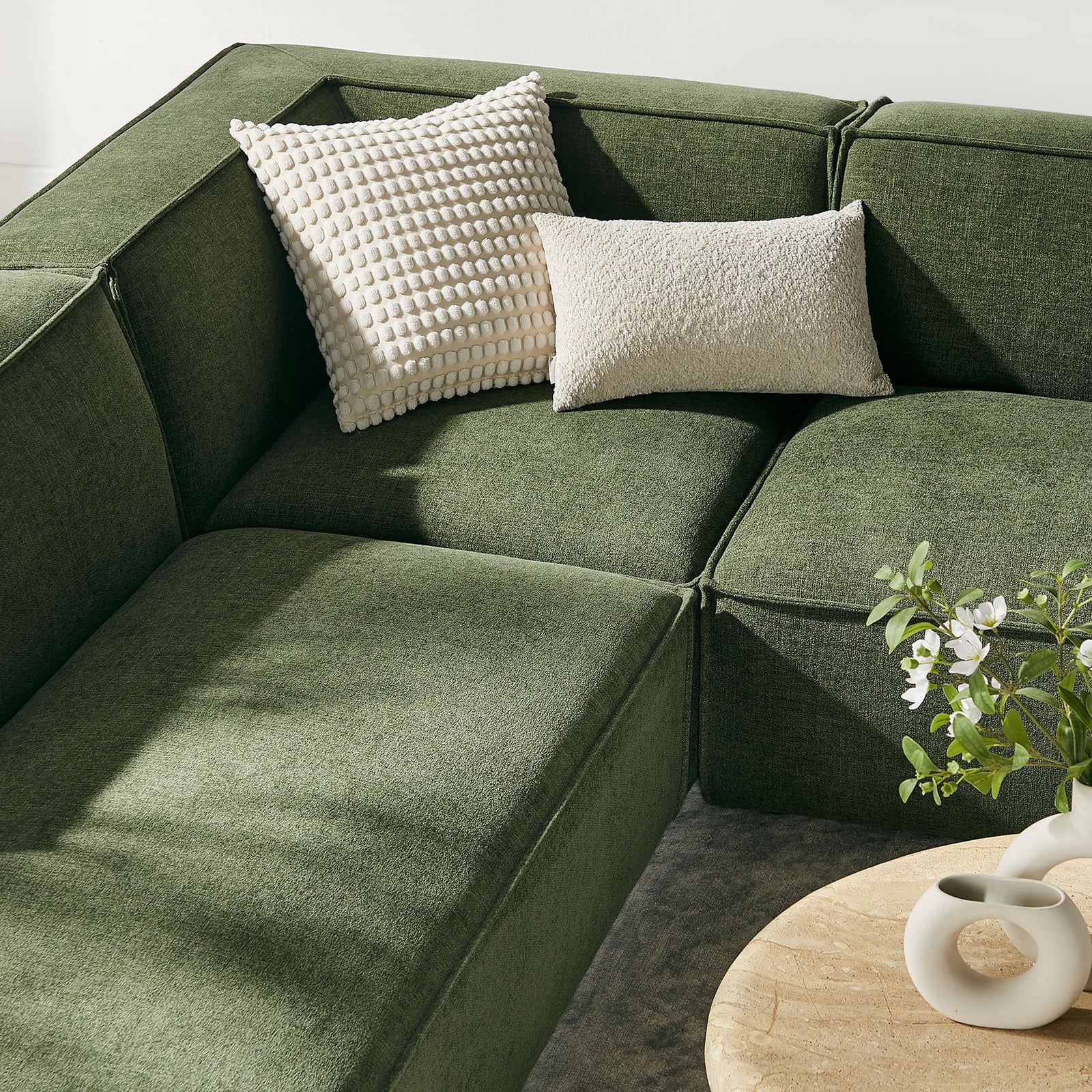 Textured performance fabric and plush cushions create a cozy corner on the foliage green Restore sectional || EEI-7415-FOL || detail_room