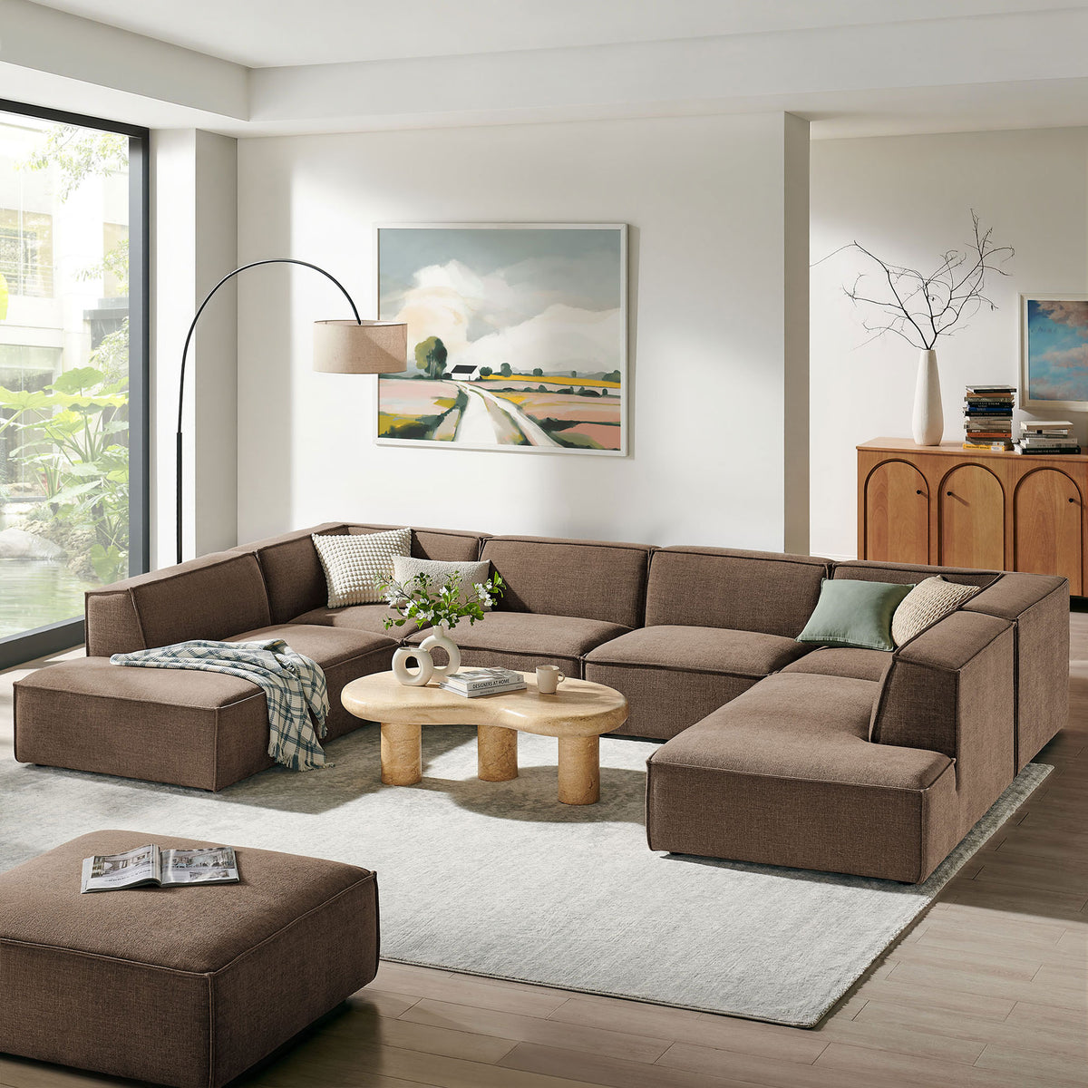 Restore sectional creates a cozy mocha seating hub in a bright contemporary living room. || EEI-7415-MOC || front_angle_room