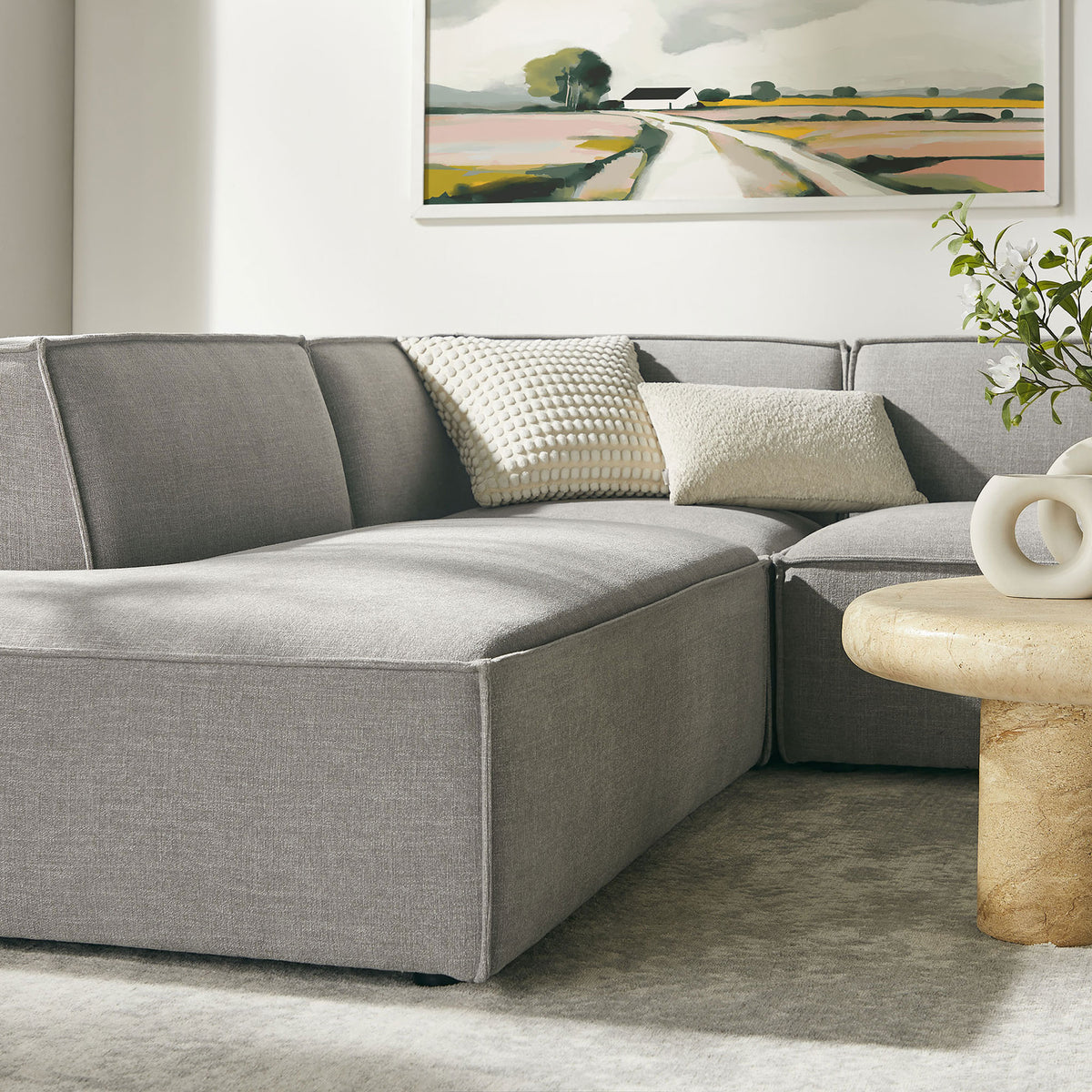 Left-facing chaise of pewter modular sectional offering an inviting spot for stretching out in style || EEI-7415-PEW || front_angle_partial_room