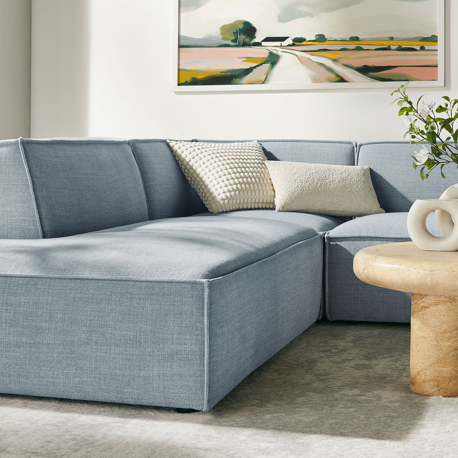 Extended chaise lounge section of the sky blue modular sofa, perfect for stretching out with plush, supportive cushions || EEI-7415-SKY || front_angle_partial_room