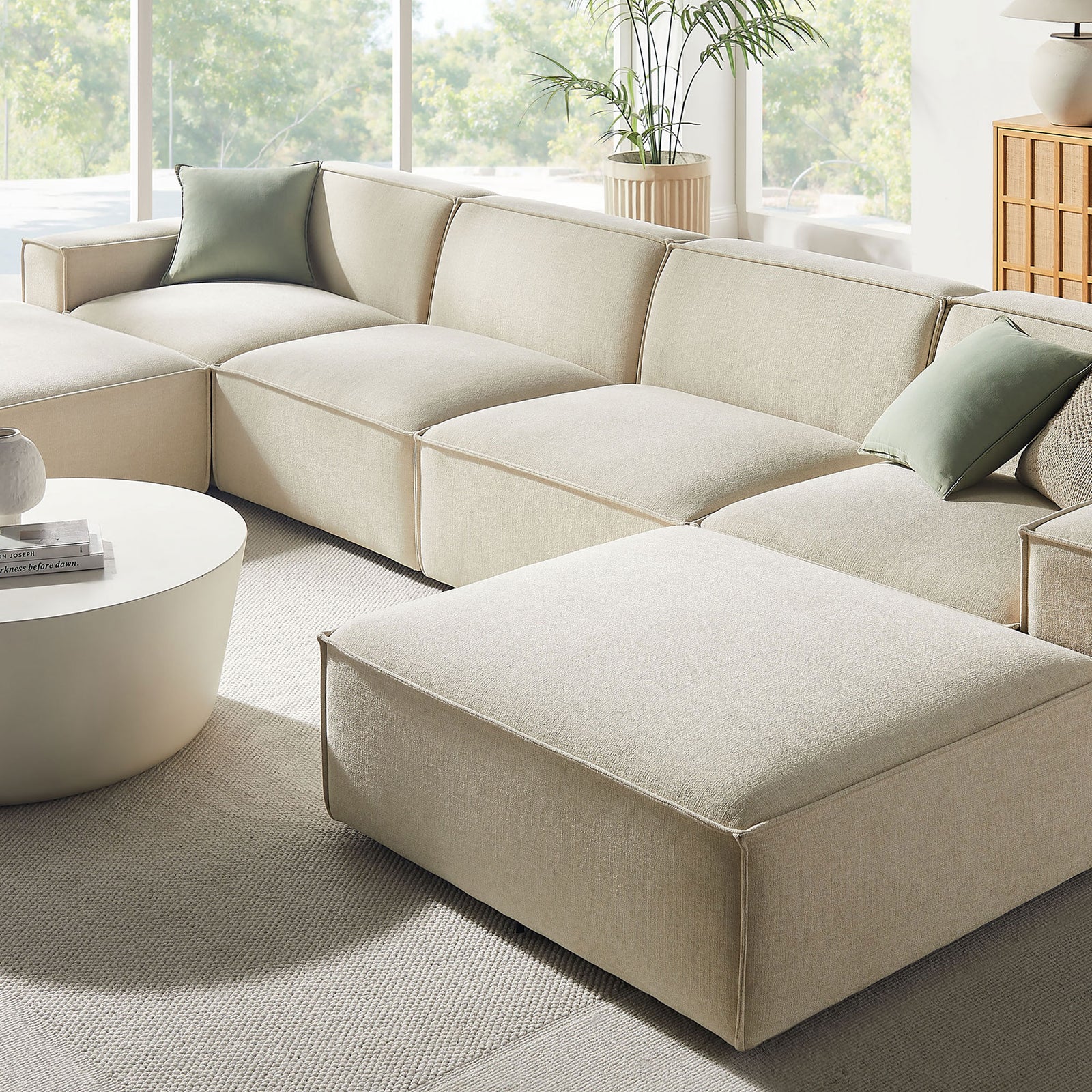Close-up of the ecru modular sectional in a sunlit room, highlighting deep cushions and soft performance fabric || EEI-7417-ECR || detail_room