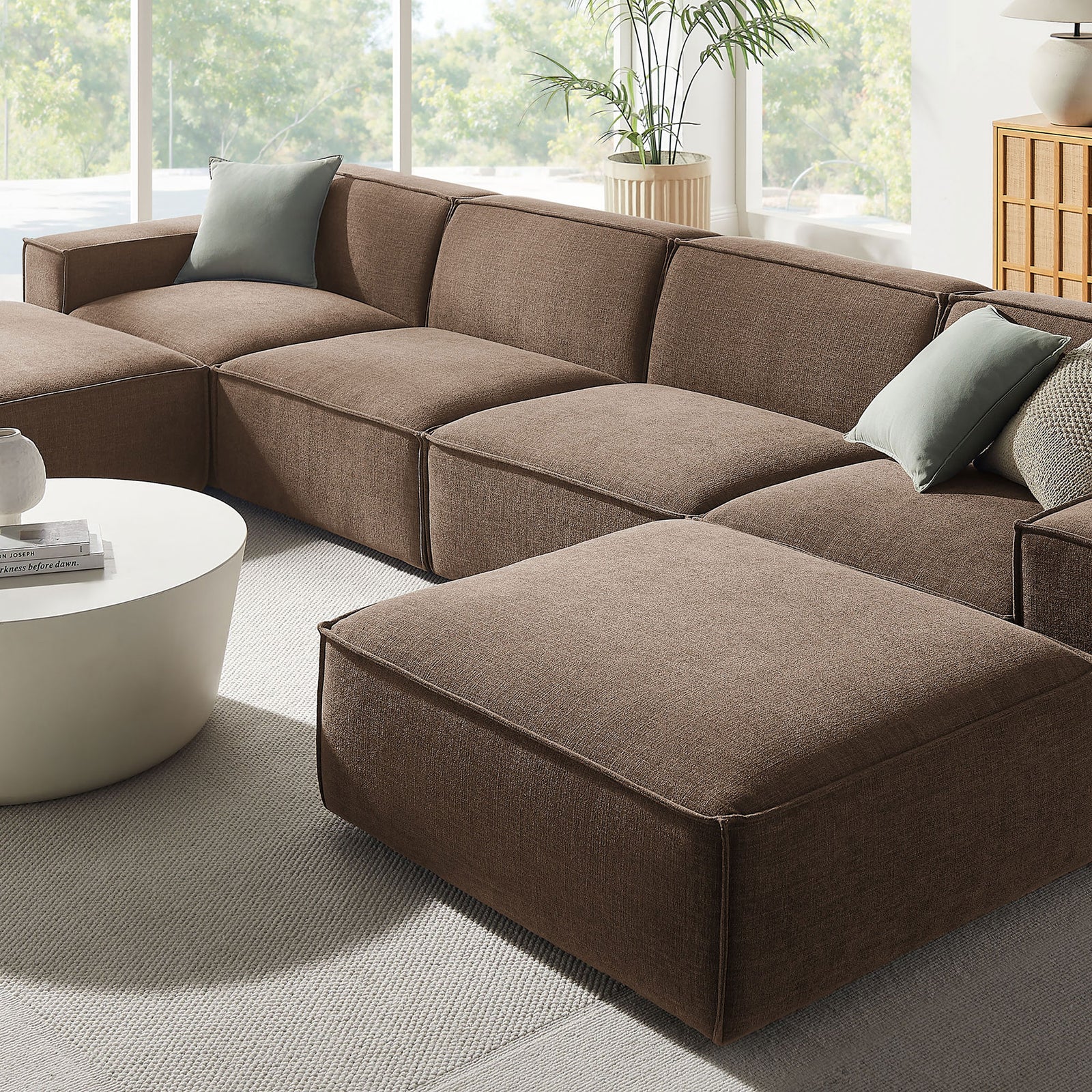 Cozy corner of the mocha modular sectional with smooth performance fabric and accent pillows || EEI-7417-MOC || detail_room