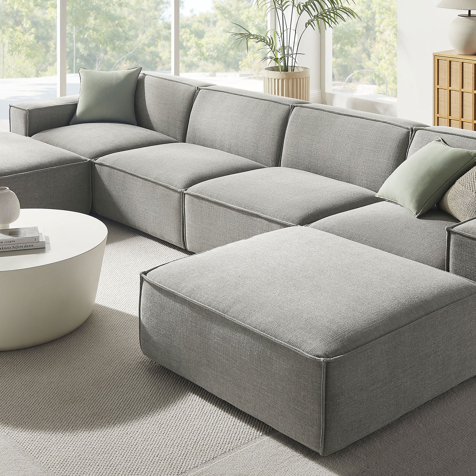 Pewter modular sectional chaise with ottoman, layered pillows, and soft textured performance fabric || EEI-7417-PEW || detail_room