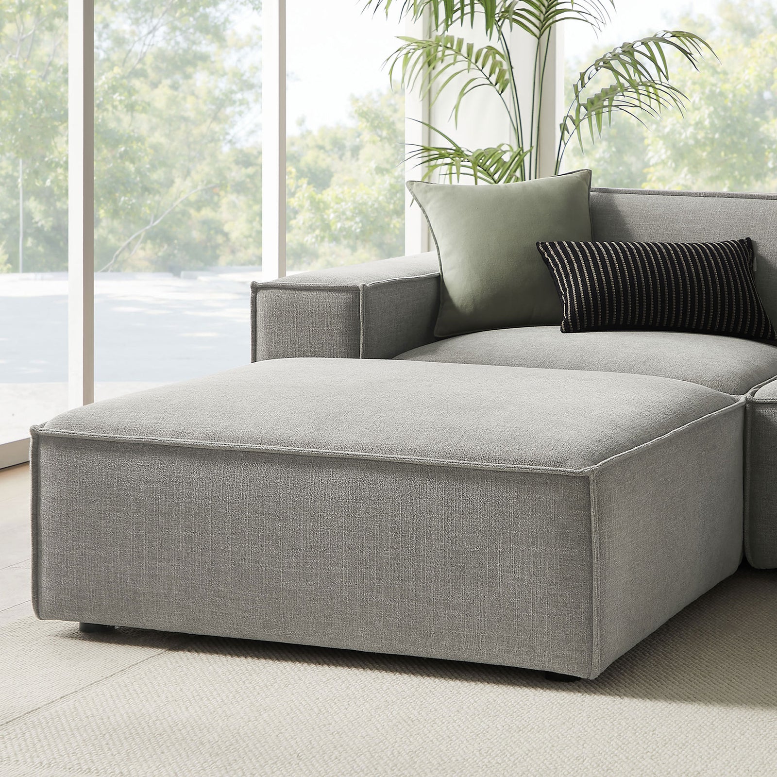Left-arm chaise end of the Restore sectional with accent pillows and inviting lounge-ready cushions || EEI-7417-PEW || detail_room