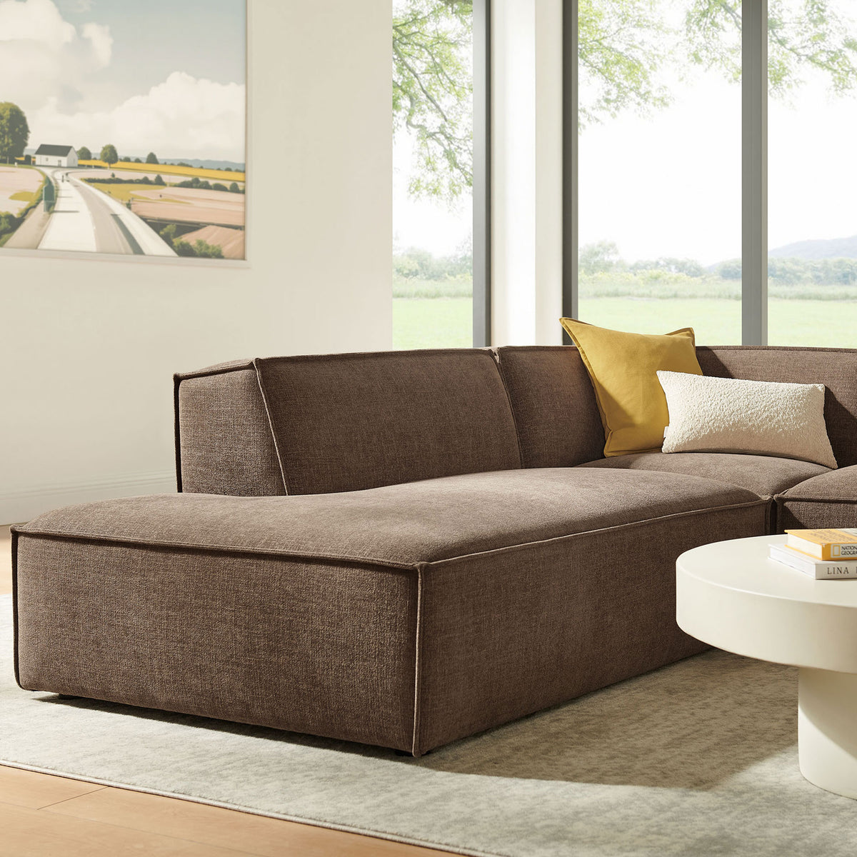 Chaise end of the sectional shows the smooth mocha upholstery and neat piping for a tailored, modern look || EEI-7419-MOC || detail_room