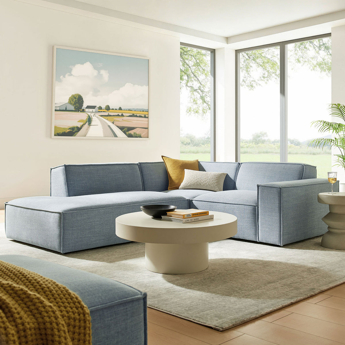 Inviting sky blue sectional anchored by a chaise, perfect for gathering family in a modern living space || EEI-7419-SKY || front_angle_room